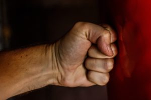 Angry Fist Against Wall in Domestic Violence Case
