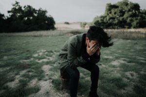 Sitting Young Man Looking Stressed from Probation Violation